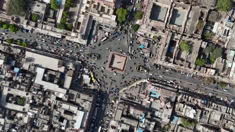rotating aerial drone shot of highway with traffic passing through jaipur city