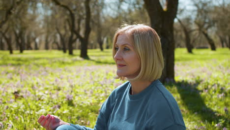 woman meditating on yoga mat