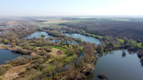 Flying-over-the-Westbere-Marshes-and-lakes-in-Kent,-England