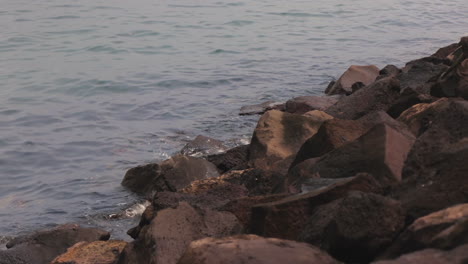 Rocks-by-St-Kilda-Pier-where-penguins-live,-calm-water,-day-time-Australia,-Melbourne