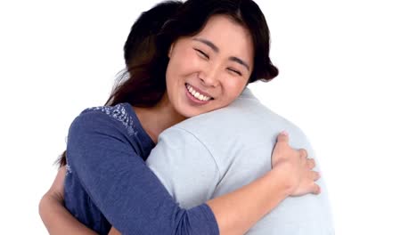 Happy-Asian-couple-hugging-each-other