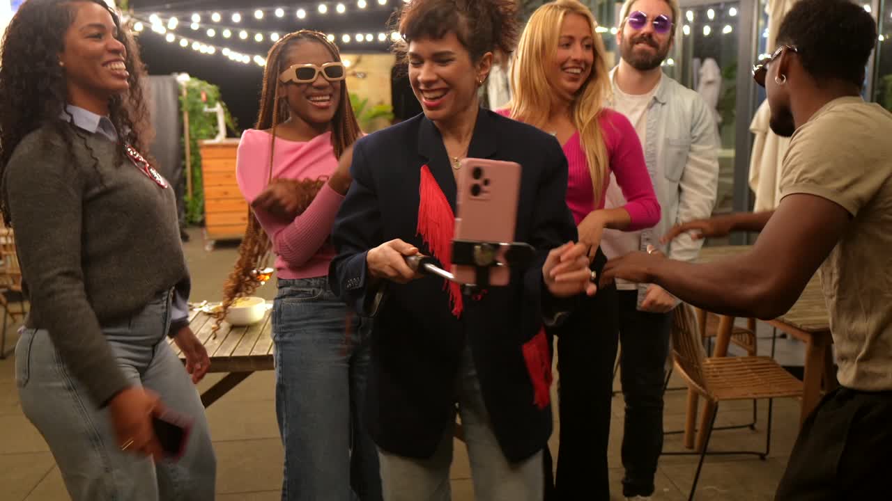 Group of friends having fun and taking selfies