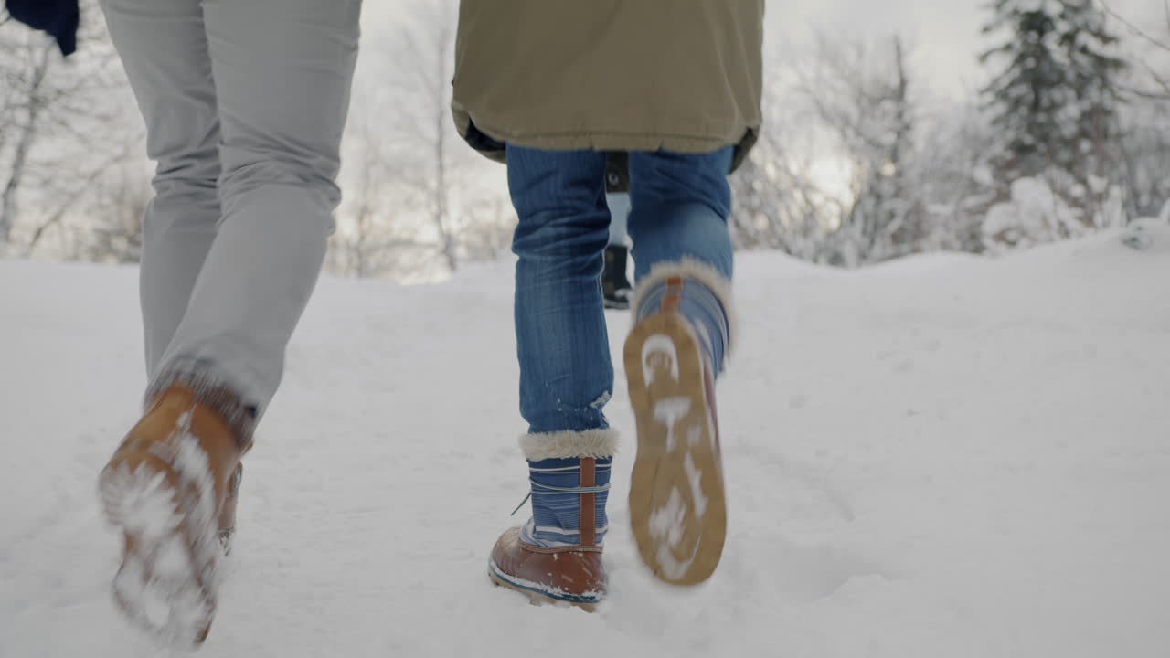 Couple and Family Hiking in Snowy Mountains