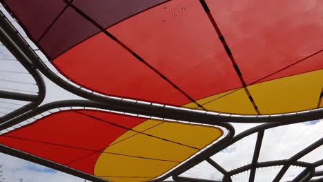 Scarborough-Beach,-Perth---Sun-Shade-Canopy,-Panning-Overhead-Shot