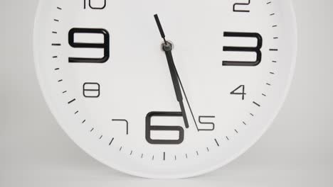 wall clock on white background, time starts walking at 5 o'clock.