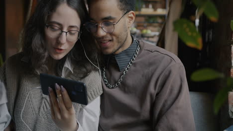 couple enjoying a video call in a cafe