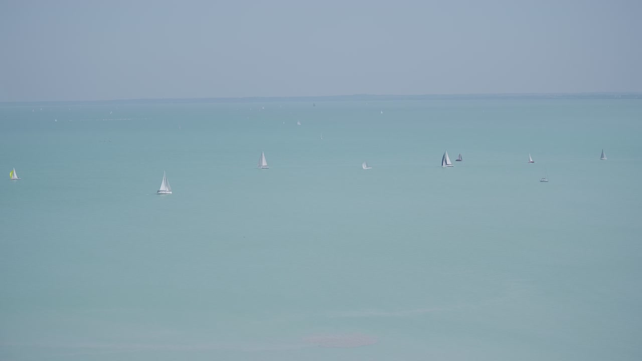 Sailboats On The Blue And Serene Lake Balaton In Hungary. Aerial Wide Shot