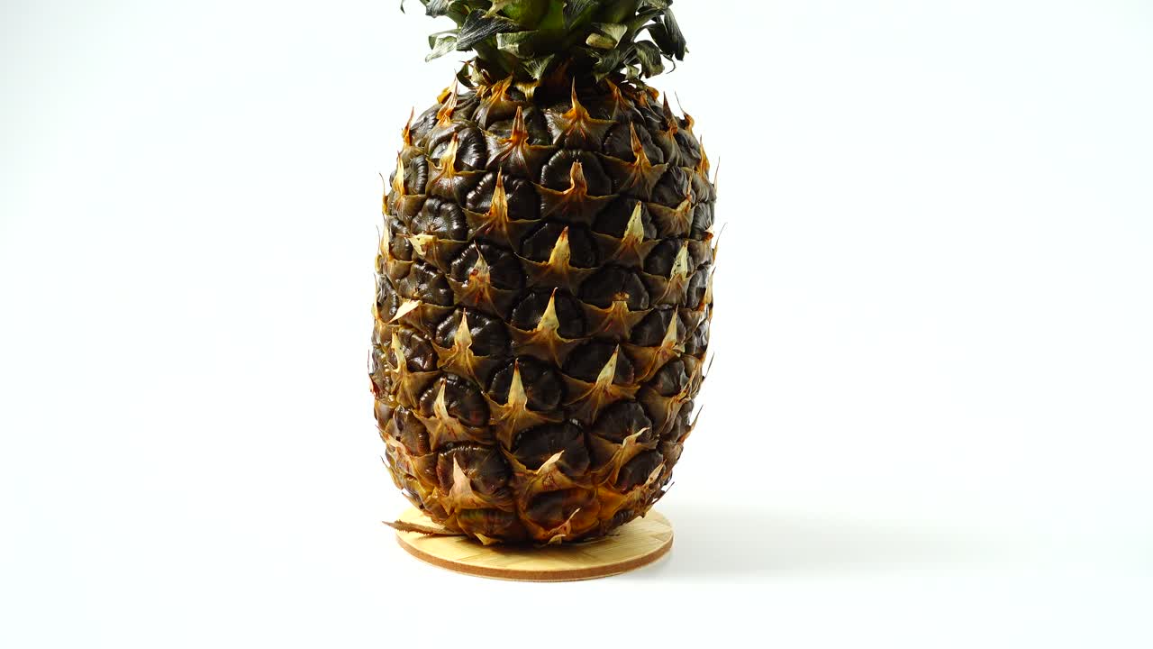 Pineapple, shooting in the movement. Healthy food