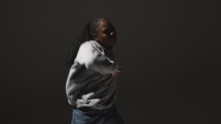 Full Length Studio Portrait Shot Of Young Woman Dancing In Spotlight 3