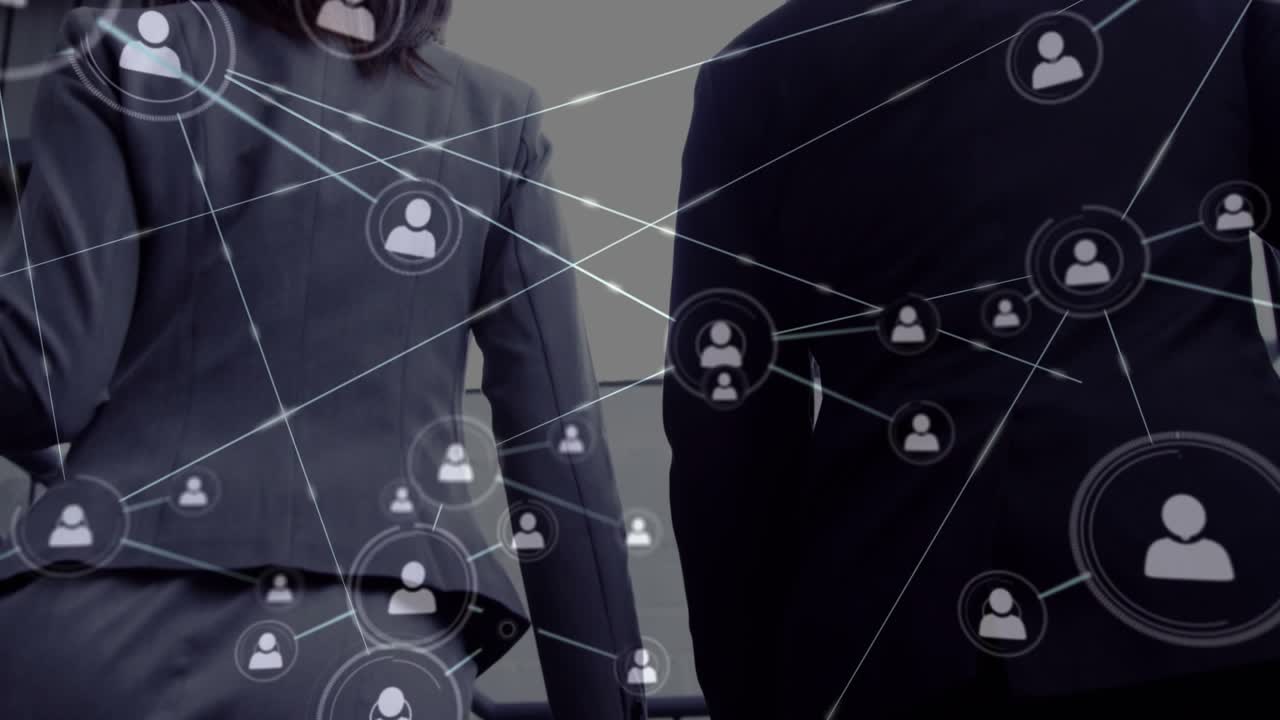 Vertical video: Walking duo in blazer, suit up metal stairs to landing, network growing after node