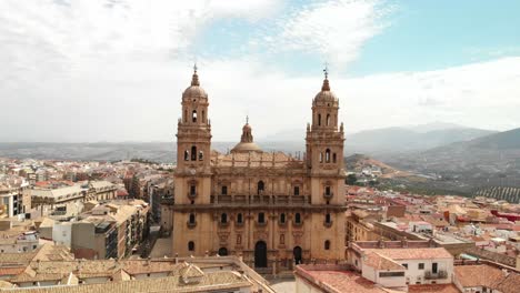 Spain-Jaen-Cathedral,-Catedral-de-Jaen,-flying-shoots-of-this-old-church-with-a-drone-at-4k-24fps-using-a-ND-filter-also-it-can-be-seen-the-old-town-of-Jaen