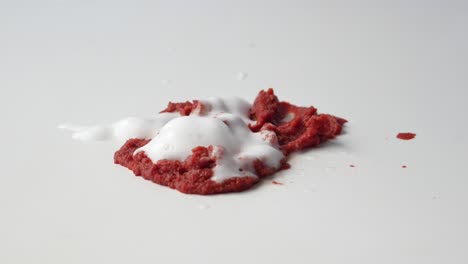 tomato paste spilled on a white countertop