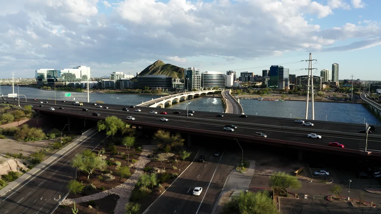 Drone shot approaching Arizona's Red Mountain Freeway filled with commuting cars