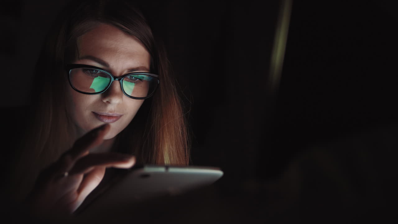 Woman Working Late Night on Tablet