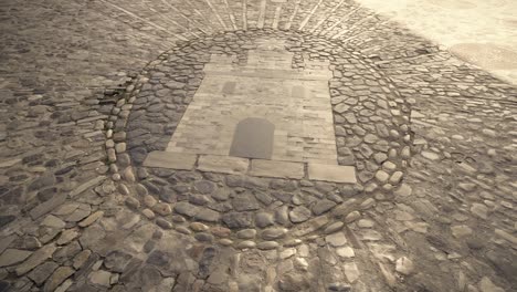 dibujo de castillo en piedra, en el suelo, arte de adoquines, medina sidonia, cádiz españa
