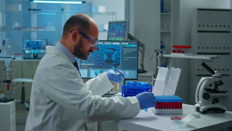 Scientist-putting-blood-sample-from-test-tube-with-micropipette-in-petri-dish