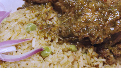 showing the traditional peruvian dish "arroz con pato" in slow motion