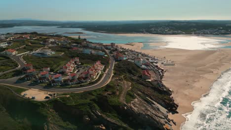 aerial view revealing foz do arelho and lagoa de obidos on a sunny day, oeste region, portugal