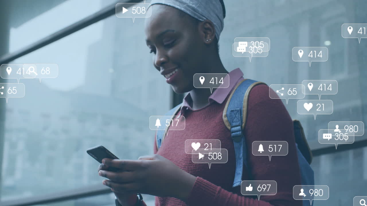 Animation of media icons over african american woman using smartphone