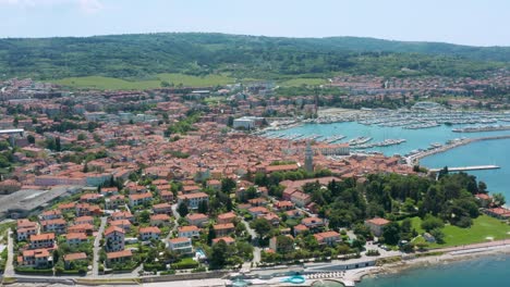 aerial arc dolly shot over the city of izola, slovenia pulling up on st