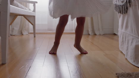 happy little ballerina girl practicing ballet dance wearing tutu playing pretend game at home enjoying childhood imagination 4k footage