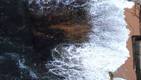 polluted sea waves, malecon in santo domingo