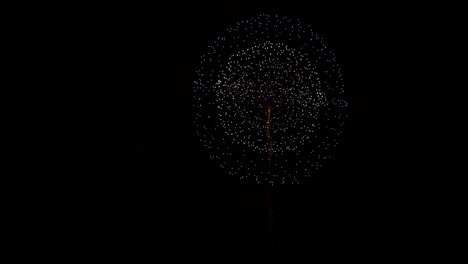 slow motion of firework launching and exploding in night sky