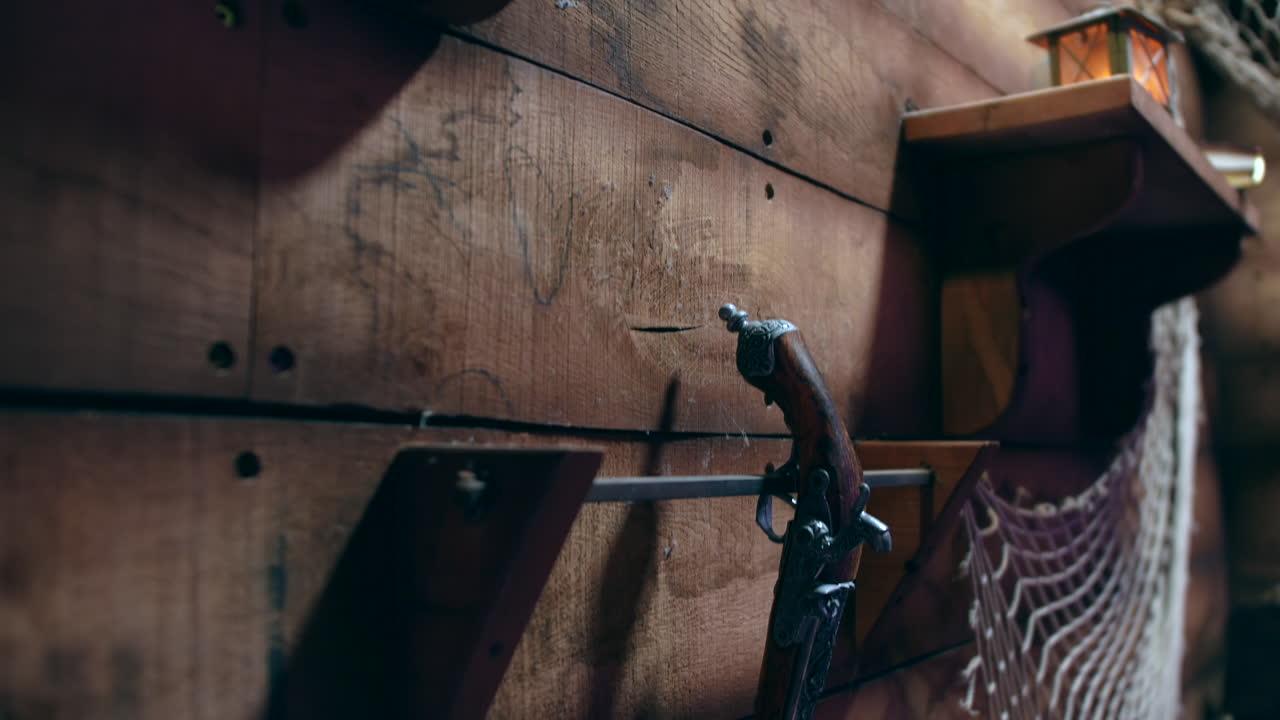 Antique Pistol Hanging on a Wooden Wall