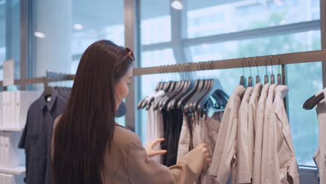 woman shopping for clothes in a fashion store