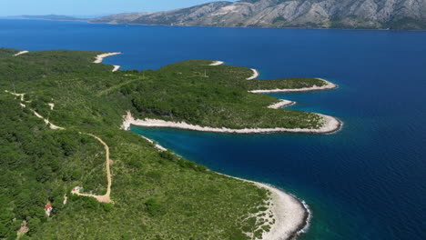 pakleni islands by the calm waters of adriatic sea in summer in croatia. - aerialshot