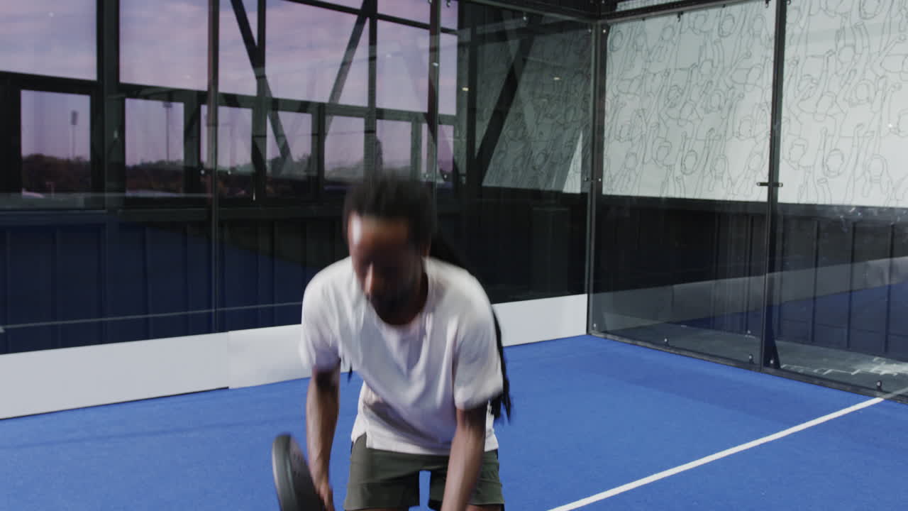 Man practicing padel tennis skills on court, focusing on ball control, copy space
