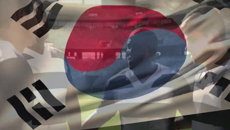 south korean flag overlay on football players practicing on field animation