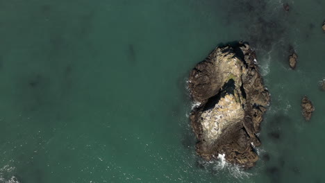 Sea-Stacks-On-Blue-Ocean-With-Coastal-Town-Community-In-Brookings-Near-Port-Harbor-In-Oregon