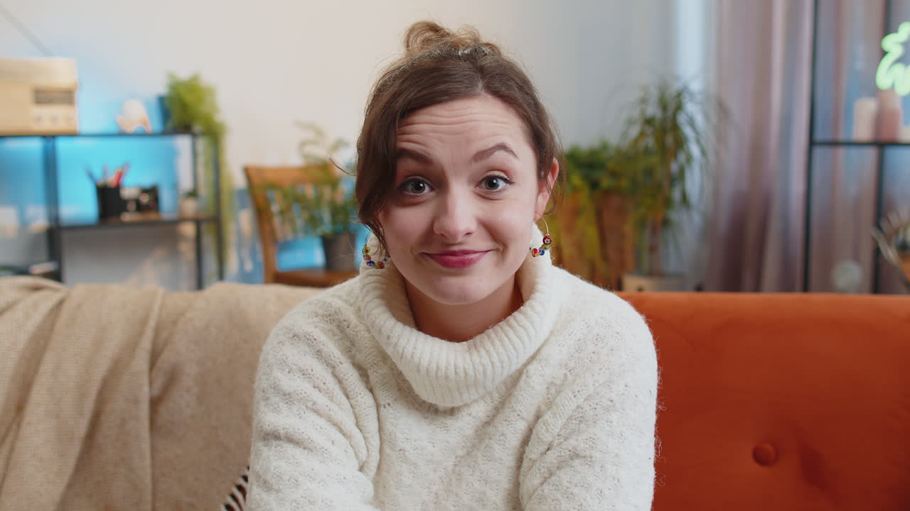 Pretty young woman smiling pointing to camera choosing lucky winner indicating inviting approve