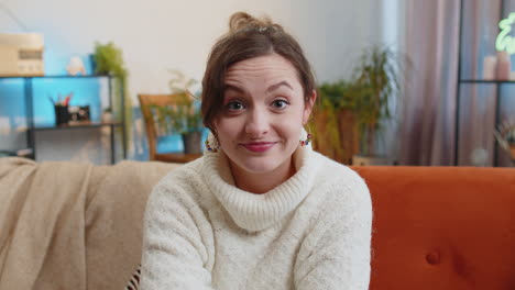 pretty young woman smiling pointing to camera choosing lucky winner indicating inviting approve