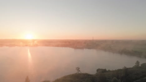 misty sunrise over a lake