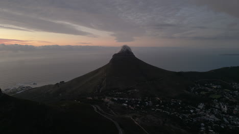 Sunset-Drone-Shot-looking-down-on-Lions-Head-Mountain-in-Cape-Town,-South-Africa