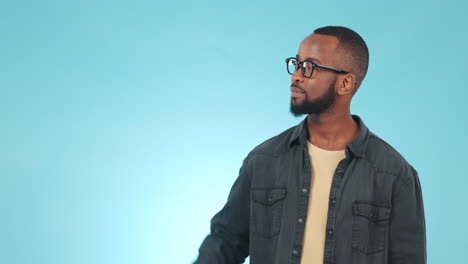 pointing, option and face of black man in a studio