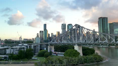 rising above brisbane's story bridge with the city in the background in australia