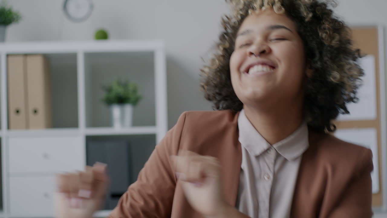 Happy Woman Dancing in the Office