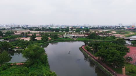 aerial view tilt up of a boat in the river in binh duong.