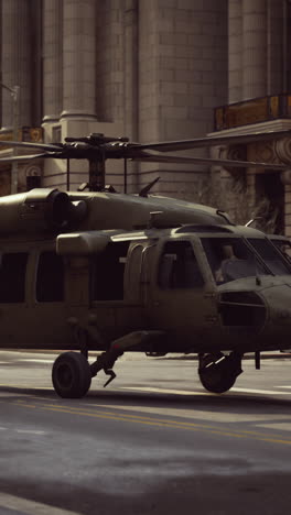 black hawk helicopter landing on city street