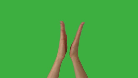 woman clapping her hands over green background