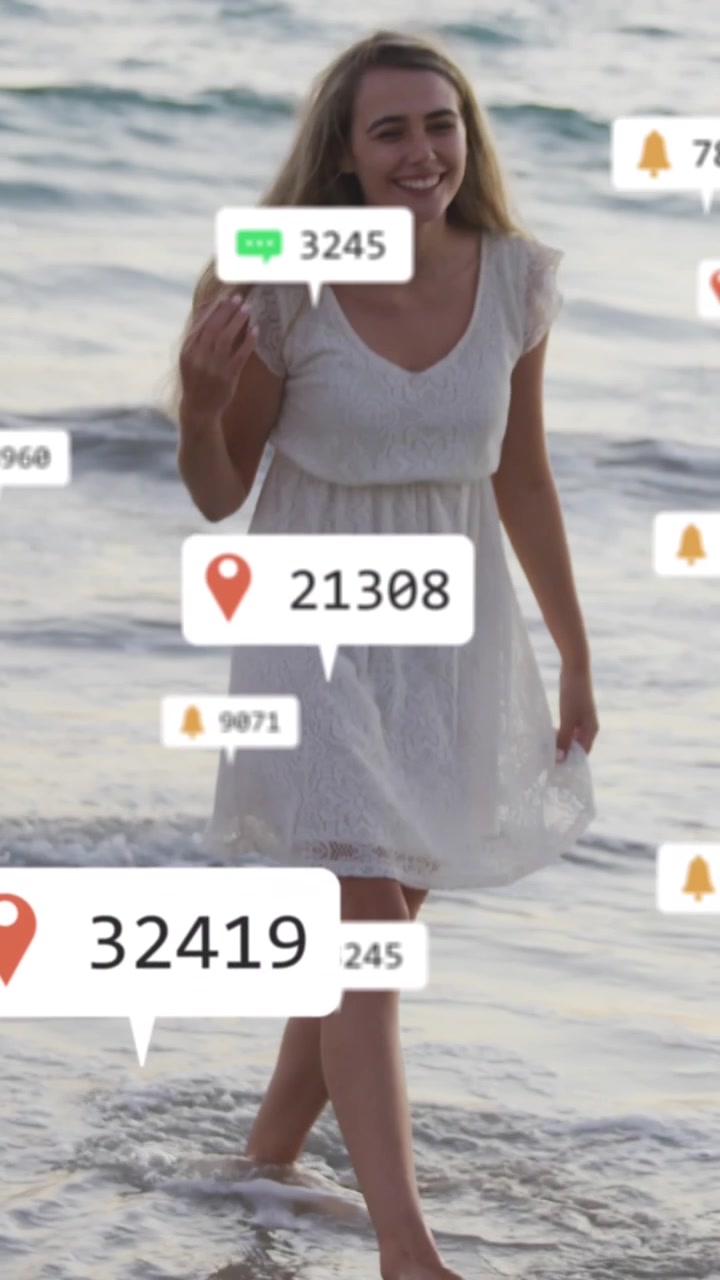 Animation of social media notifications over smiling woman on holiday paddling in the sea