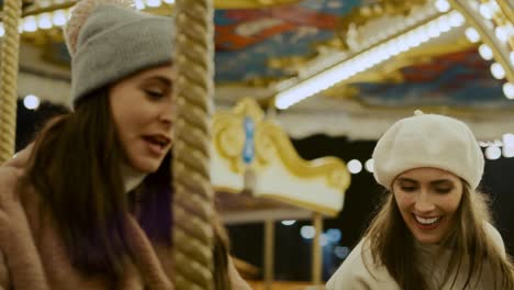 video of crazy friends  having fun on carousel  in funfair