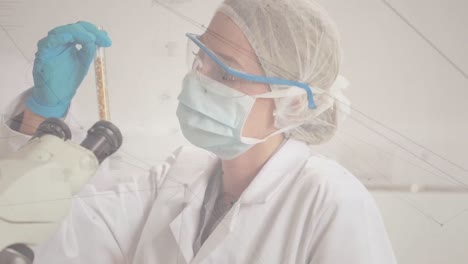 Network-of-connections-against-female-scientist-wearing-face-mask-holding-a-test-tube-at-laboratory