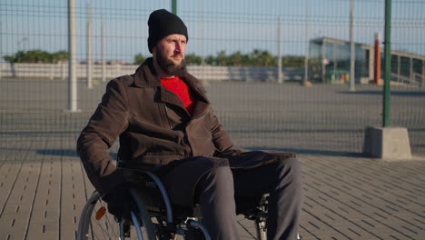 man in wheelchair outdoors