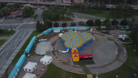 aerial pan over yellow blue carnival circus tent