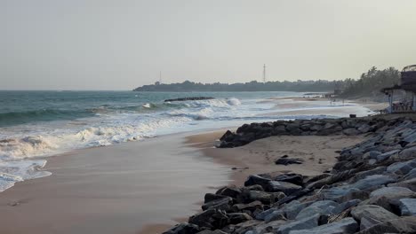 scenic coastal landscape of tangalle beach in southern province sri lanka with white frothy water waves in dusky sunlight