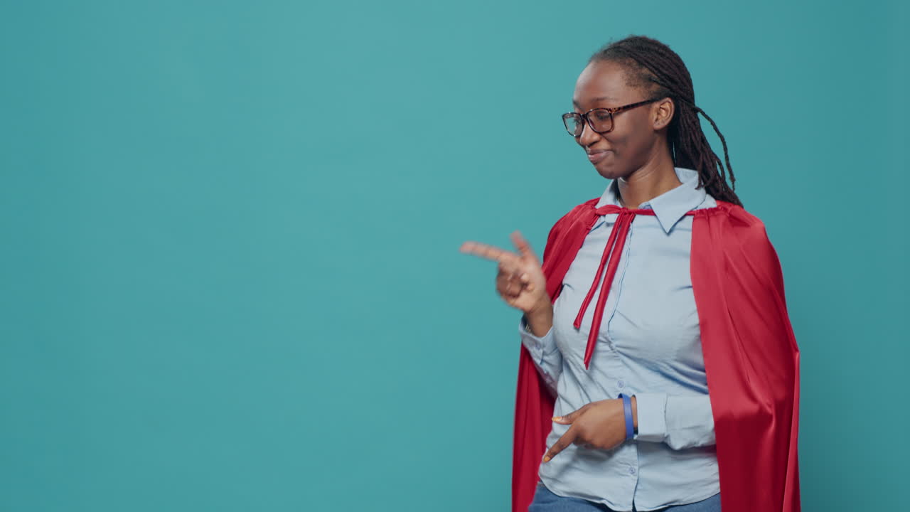 Woman with cape costume pointing left and right